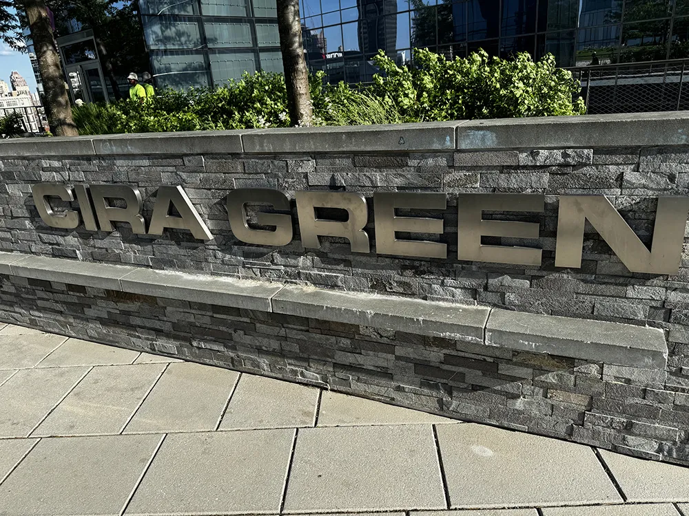 Circa Green Sign on stone wall