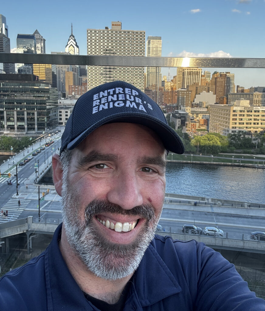 Seth taking a selfie with Center City skyline in the background