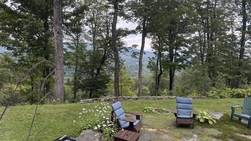Weston Vermont Backyard. Adirondack Chairs and a beautiful mountain view!